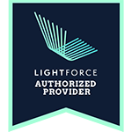 Lightforce Badge with Lightforce logo and text: "Lightforce Authorized Provider" on a dark background with a light green border.