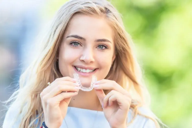 invisalign clear aligners orthodontics concept young attractive woman - How Does Invisalign Work in Leominster, MA
